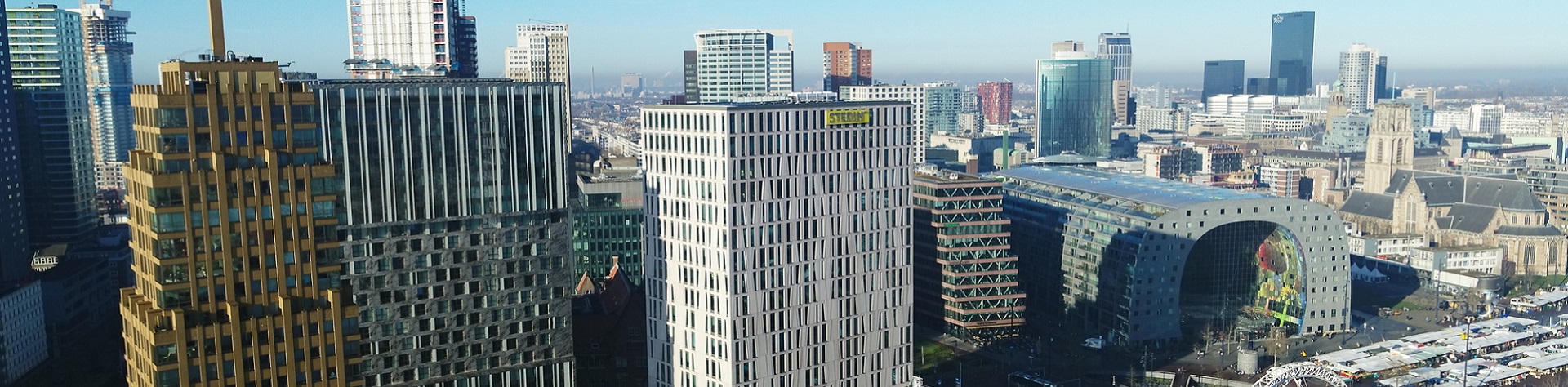 Stadbeeld van Rotterdam met onder meer kantoor Stedin en Markthal